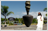 Sri Sri Ravi Shankar transposed beside the Spinning Top sculpture at Trusts Stadium, Henderson, Auckland, where he is sheduled to be in April 2010.