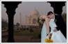 Change the background in a photo. In this example, the wedding venue has been changed from a hotel to the Taj Mahal monument in India.