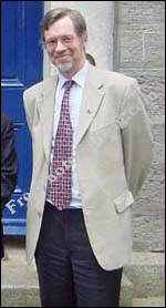 Kindly looking professor dressed in formal suit
