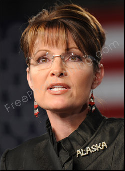 Photo editing required to touch up or remove Sarah Palin's glasses. The resultant 'after' photo can be seen on right.
