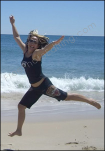Photo editing required: Photo of girl on the beach who is madly in love with Austalian actor Hugh Jackson. She wants Hugh Jackman to be placed in the same pic as her. The resultant photo after editing can be seen below.