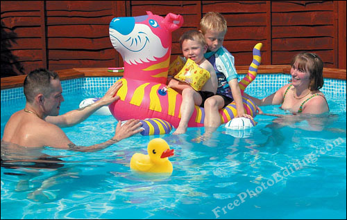 Rubber duck added to family photograph in swimming pool