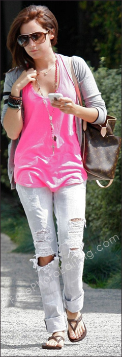 Photo retouching to fix tear in jeans. See 'after' photo on right. Ashley Tisdale's jeans are virtually in rags. Is that supposed to be stylish??