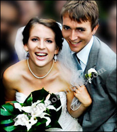 Photo editing job: People in the background have been blurred in this wedding party photo; focus has been brought on the newly wedded coouple.