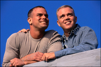 The gay couple in this photo want the background changed to a nice sky scene.
