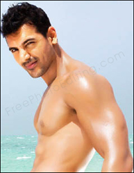 Photo edit required: This is a photo of Indian actor John Abraham that needs to be merged with Maradona's pic and they both need to be placed on the beach, under the bridge ;). John's 'gay' role in the film Dostana is partly the focus of this photo editing assignment.