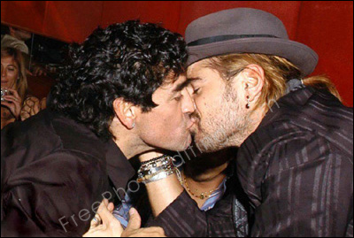 Photo editing service: This is a photo of Maradona & Colin Farrell kissing in a dark restaurant in 2005. The two lover boys need to be placed in the outdoors, against a nice refreshing background.
