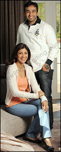 This is a photo of Shilpa Shetty and husband Raj Kundra. Photo editing services are required to move the couple to an Eiffel Tower scene. The resultant photo after manipulation can be seen below.