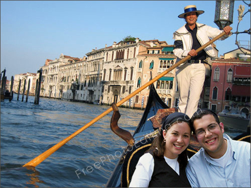 This is a photo editing and photo retouching example in which the background has been changed in a couple's photo. They were seated in a patio, and now they are taking a Gondola ride in Italy. The original photo can be seen above.