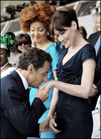 This is a photo of President Sarkozy and Carla Bruni. Photo manipulation (background change) is required to extract the couple from this picture and place them in a Taj Mahal photo to mark their visit to India in December 2010. The edited photo can be seen below.