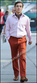 Young man in pink shirt and mustard-orange trousers