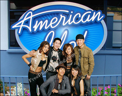 The plain background in dance group Kaba Modern's studio photograph has been removed and the group has been moved into the outdoors against American Idol signage (perhaps outside a Disney studio?)