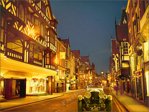 After photo editing: Photo of a vintage Bentley car has been cut out of its original background and placed in a London street. The entire (now composite)  photo has been given a yellow hue.