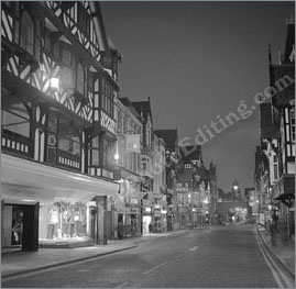 Before photo edit: This is a dramatic shot of a London shopping street as it would look late at night when every thing is closed down. The building exteriors are lit up, as also the show windows, lending a mysterious glow to the surroundings.