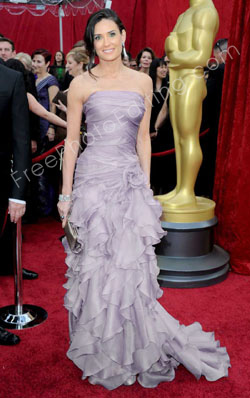 Demi Moore's gown colour changed to lilac with the use photo editing. The original photo can be seen on left.