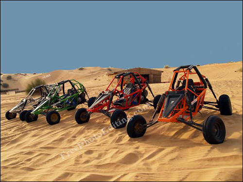 Dune buggies ready for action in the desert sands.