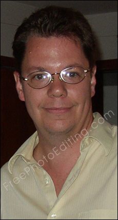 The eyeglasses this man is wearing have caught the camera flash reflection. The glare on the spectacle lenses needs to be removed with photo editing.