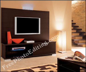 Modern living room done in warm colours. Room has plasma televsion and elegant TV cabinet. Stairs going up to the bedrooms are visible.
