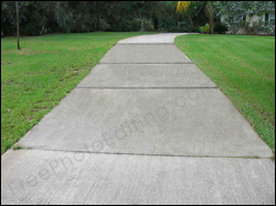 This is a photo retouching example in which extensive rust stains have been removed from a concrete driveway.
