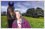 Image background has been replaced with photo manipulation. Woman and her horse have been placed against a beautiful scenic view of a flower meadow, trees and sky.