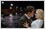 Replace background: Change day scene on street to night scene at beach.