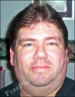 Photo editing service required: This is a close-up photo of an overweight man. The subject needs to be made to look thin digitally.