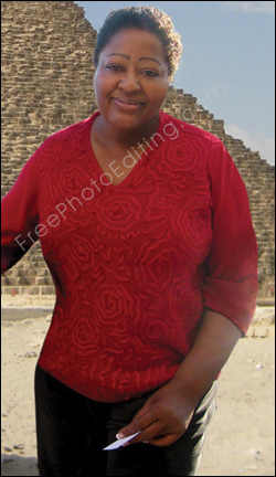 This is a photo retouching example in which a mature black woman has gone through virtual weight loss. She has also ended up looking younger, and more cheeful. What she looked like before can be seen on left.