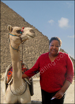 This is a photo of an overweight woman holidaying in Egypt. She wants to look thinner in the photo.