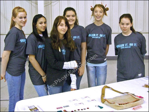 Girl (second from right) made tallest with the use of photo editng.
