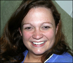 Photo of woman in thirties with marks on face, and no make-up