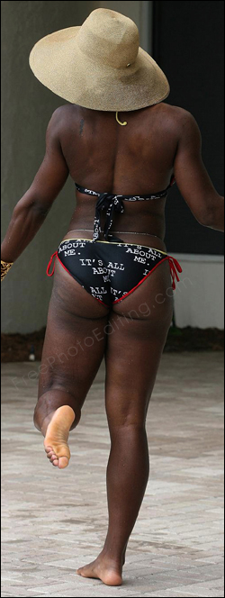 Serena Williams looks positively ungainly and clumsy in this photo. She needs a body makeover to look graceful and more feminine. Serena's retouched photo can be seen on right.