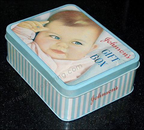 The tin box seen in this photograph has been restored digitally. The original photo of the damaged tin box can be seen above.