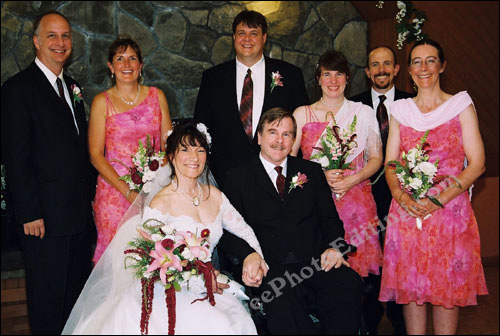 Wedding photograph (in colour) of couple along with group of relatives