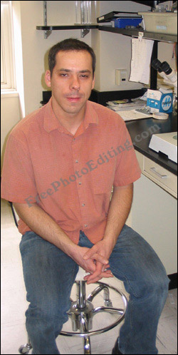 This is a photo of a man with squinchy eyes. The eyes appear to be half closed / half open. This generally happens when the skin suffers from diminished elasticity. In this case photo editing will be used to make the eyes look normal.