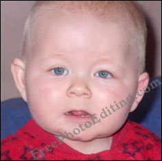 Baby's partially closed, squinchy eye fixed with photo editing
