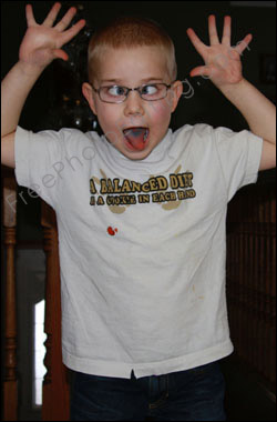 Photo editing required: This is a photo of a little boy fooling around, playing 'cross-eyed'. This needs to be corrected with editing.