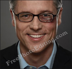 Man in broken reading glasses