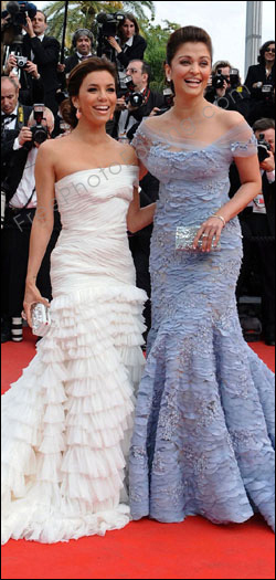 This is a retouching sample of an extra huge pouf hairstyle being changed to normal proportions with photo editing. Note that the backdrop area surrounding Aishwarya Rai's head has been extensively edited.