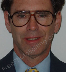 Photo editing required to fix subject's crooked smile and bifocal glasses. The edited photo can be seen on right.