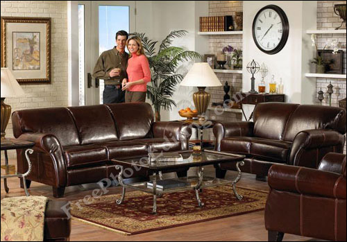 This living room displays a 5-piece Ottoman set. The wall sports an over-sized wall clock.